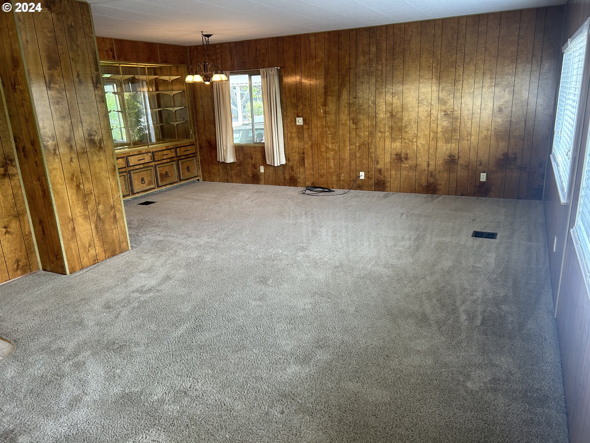 4800 Barger Drive Eugene, OR 97402 - Photo 4 of 20 a view of an empty room with a fireplace and a window
