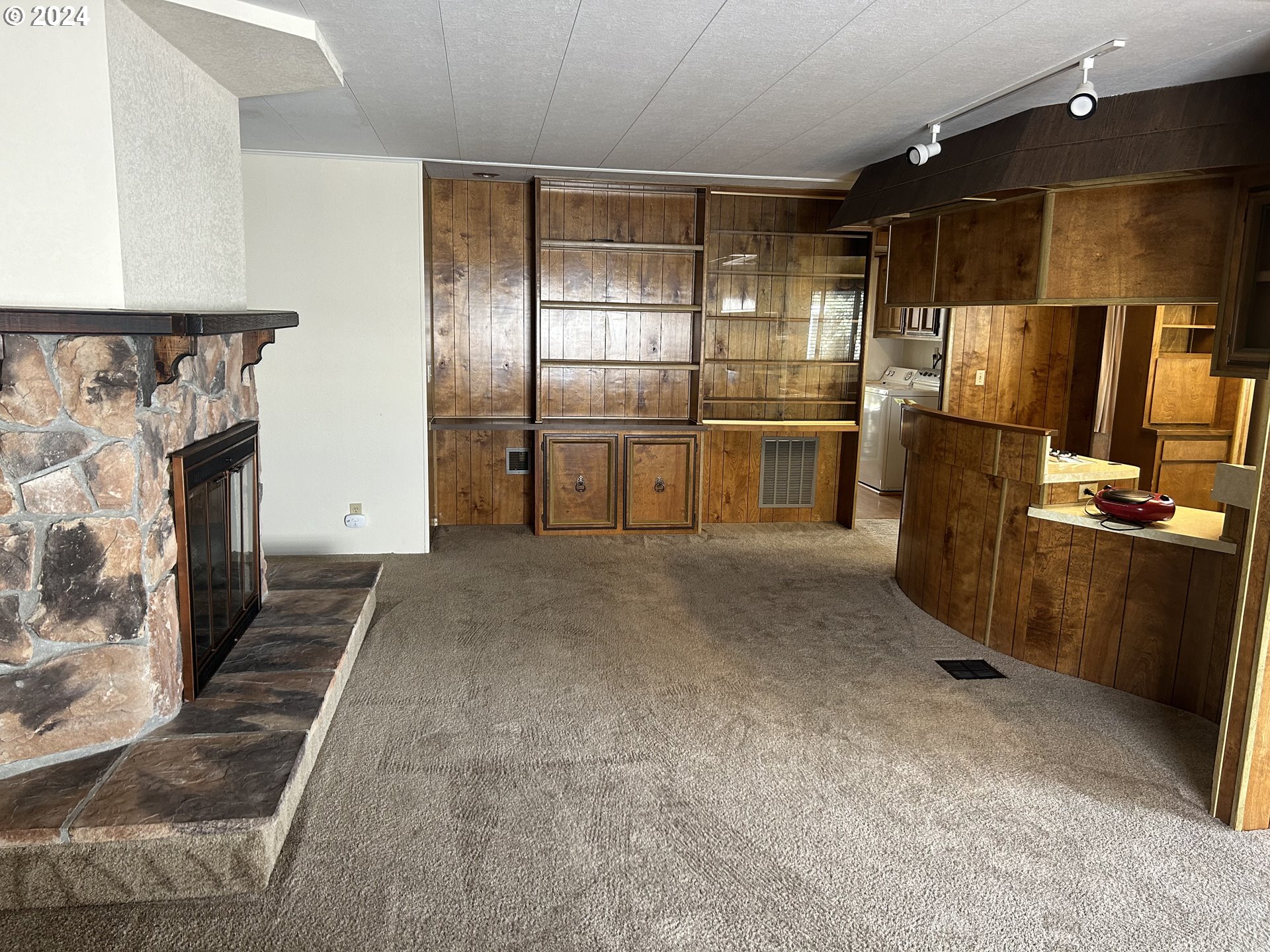 4800 Barger Drive Eugene, OR 97402 - Photo 8 of 20 a view of a refrigerator in kitchen and wooden floor