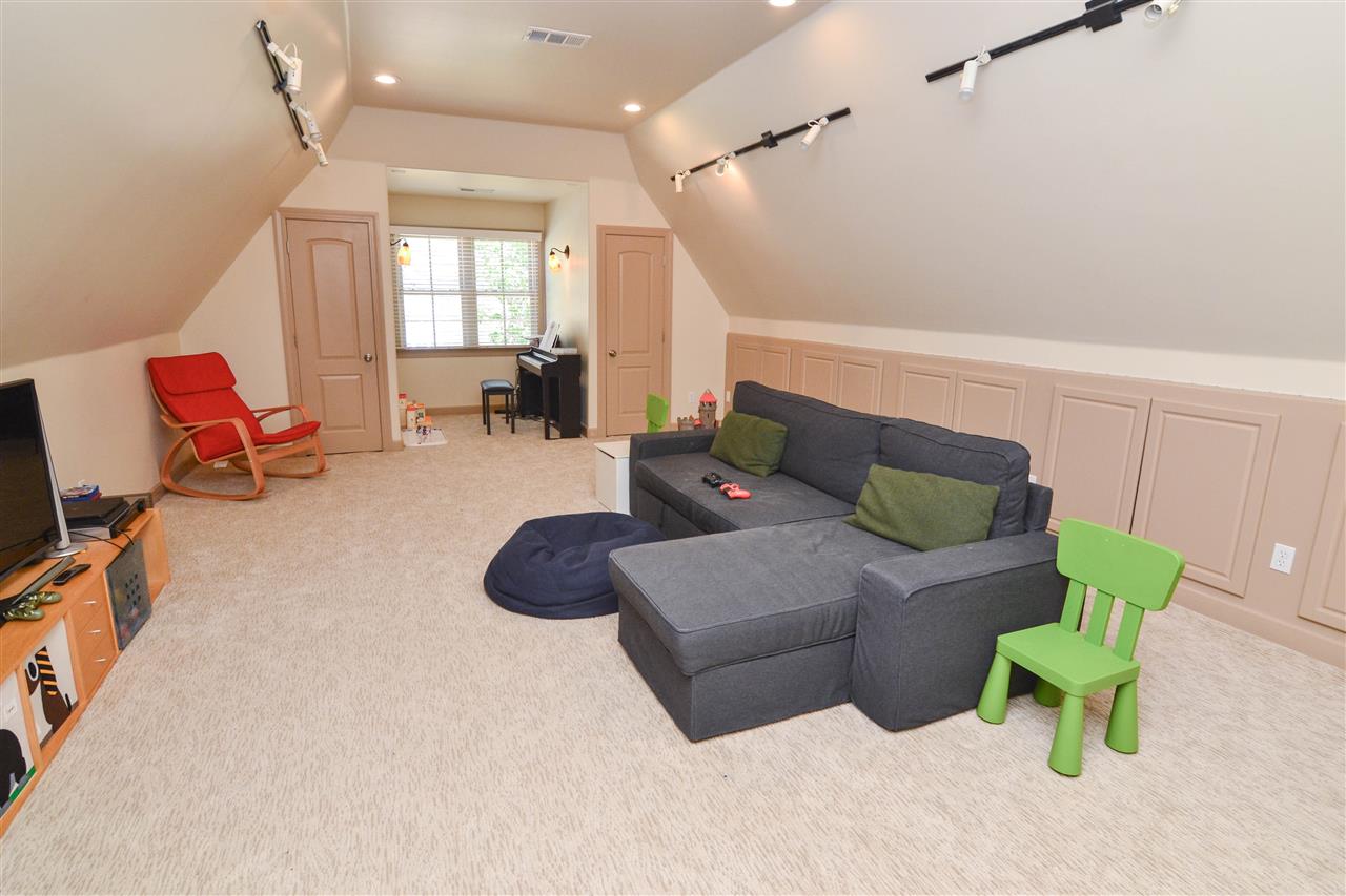 10057 Avent Ridge Cove Collierville, TN 38017 - Photo 22 of 25 Game Rm over the 3 car garage, Kids can play as they want!