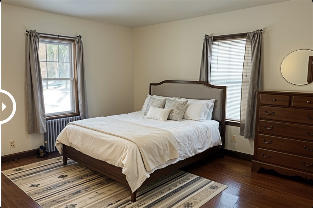 133 Douglas Road Gardner, MA 01440 - Photo 11 of 22 a bedroom with a bed window and wooden floor