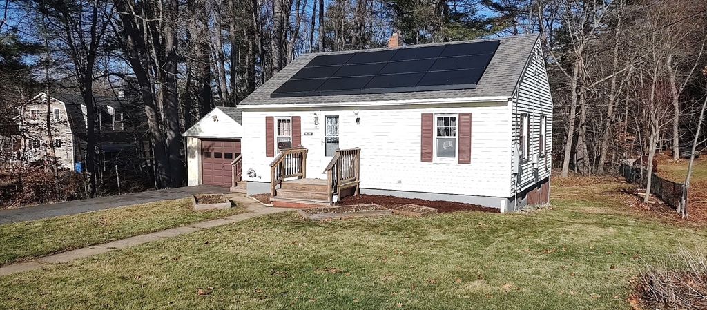 133 Douglas Road Gardner, MA 01440 - Photo 2 of 22 a view of a house with backyard and wooden fence