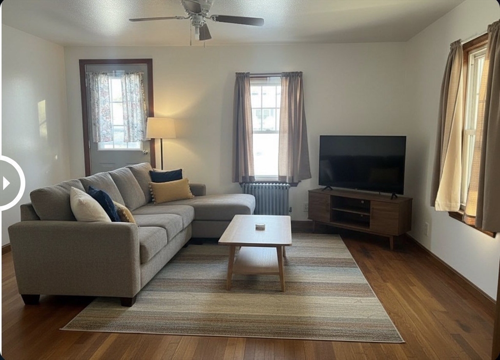 133 Douglas Road Gardner, MA 01440 - Photo 9 of 22 a living room with furniture and a flat screen tv