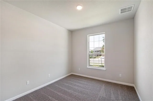a view of a house with backyard and garden