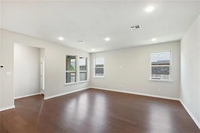 a kitchen with granite countertop a sink a stove and a microwave
