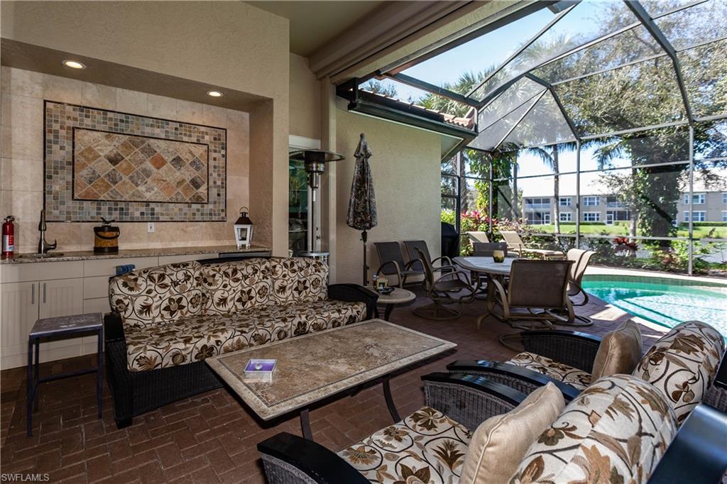 20196 Markward Crossing Estero, FL 33928 - Photo 17 of 28 a living room with furniture and a floor to ceiling window