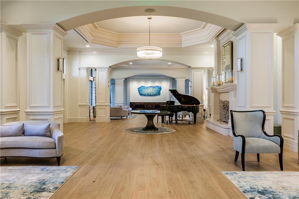 20196 Markward Crossing Estero, FL 33928 - Photo 21 of 28 a living room with furniture and a chandelier