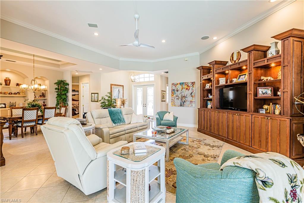 20196 Markward Crossing Estero, FL 33928 - Photo 5 of 28 a living room with furniture and a flat screen tv