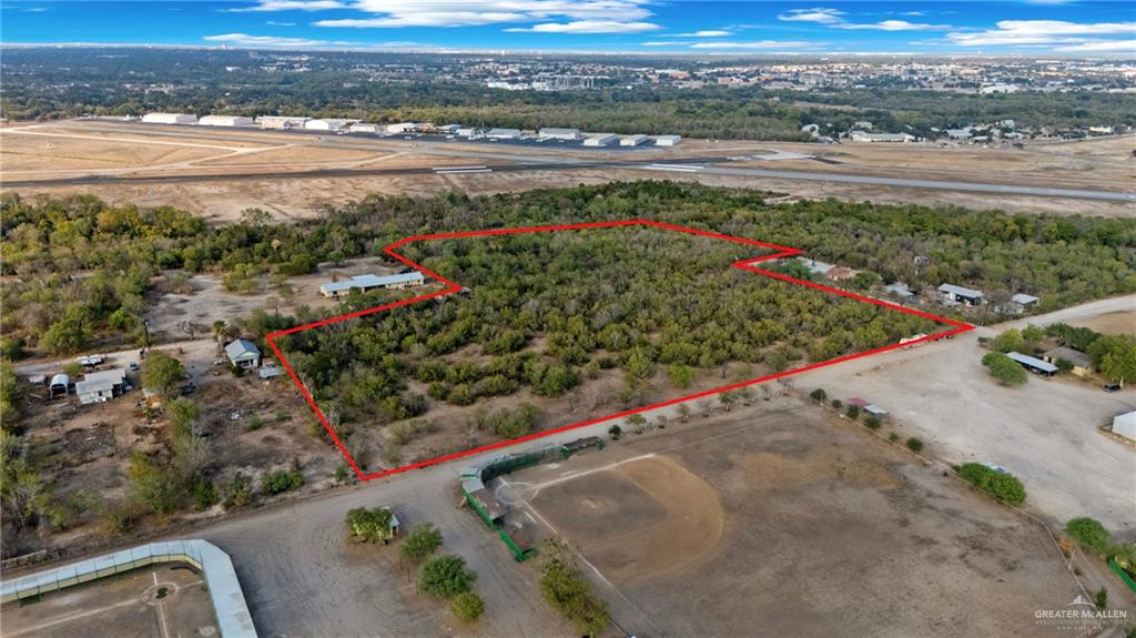 1706 East Ashley Road San Antonio, TX 78214 - Photo 6 of 16 Expansive land parcel outlined by a red boundary, featuring dense tree coverage