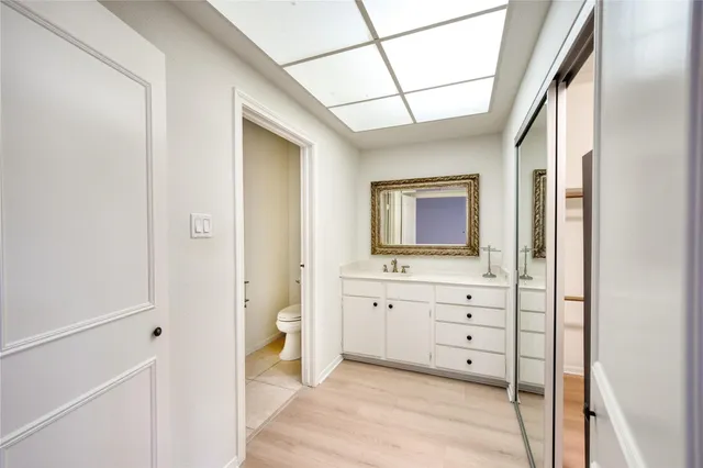 a view of an empty room and wooden floor