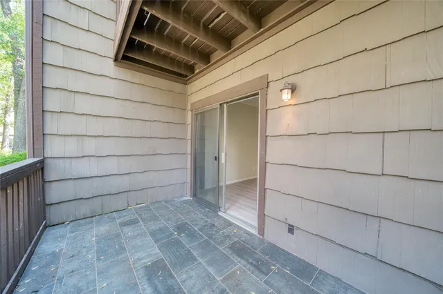 a view of a kitchen with a sink and cabinets