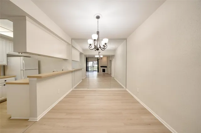 a view of a kitchen sink and cabinets