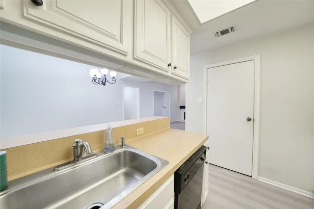 a view of a room window and wooden floor