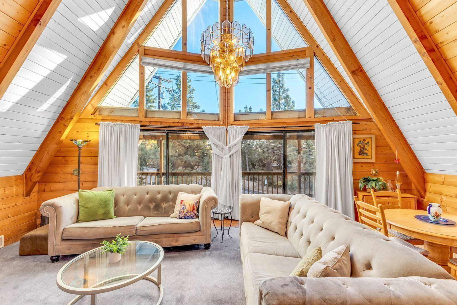 26750 Saunders Meadow Road, Unit 775 Idyllwild, CA 92549 - Photo 13 of 68 a living room with furniture and a large window
