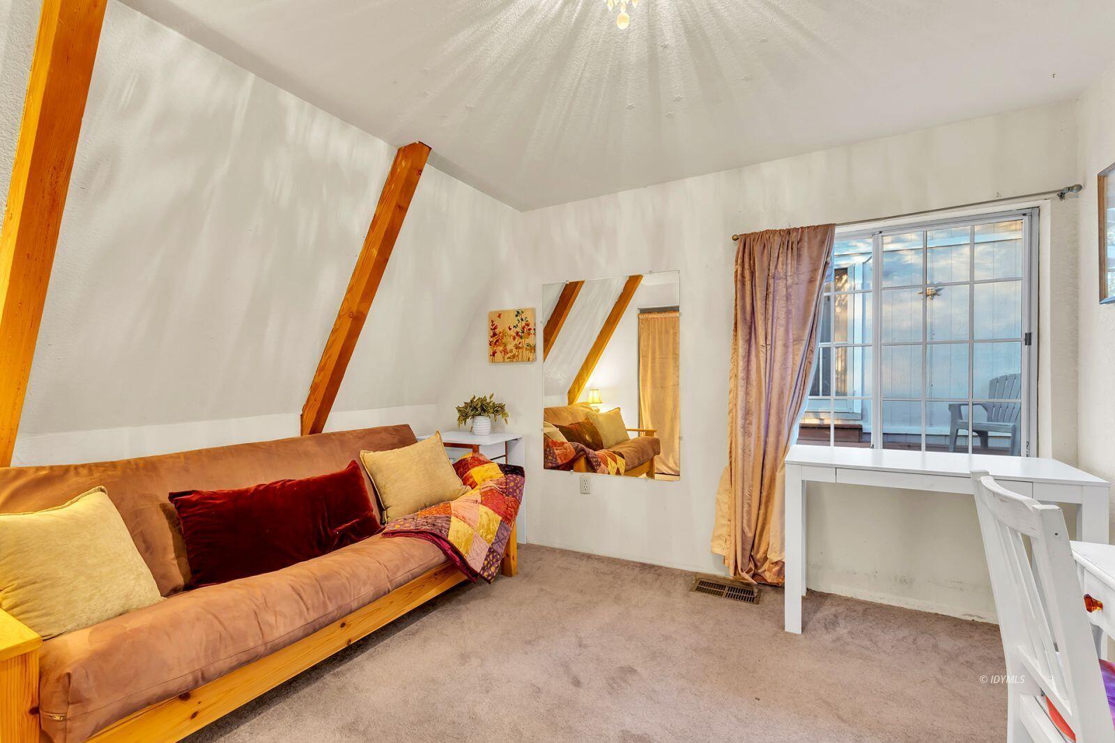 26750 Saunders Meadow Road, Unit 775 Idyllwild, CA 92549 - Photo 26 of 68 a living room with furniture and a large window