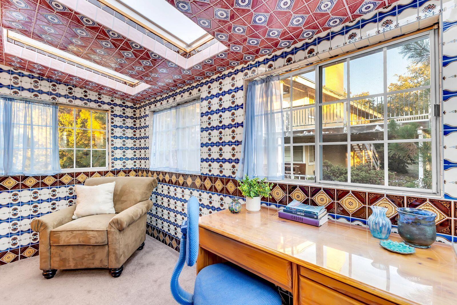 26750 Saunders Meadow Road, Unit 775 Idyllwild, CA 92549 - Photo 38 of 68 a living room with furniture and a large window