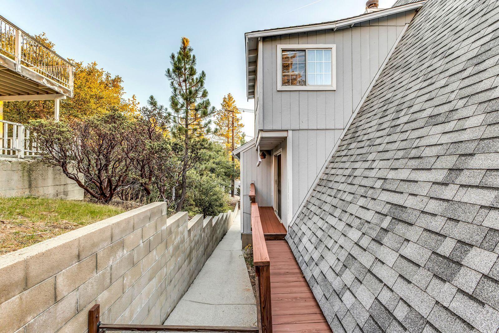 26750 Saunders Meadow Road, Unit 775 Idyllwild, CA 92549 - Photo 43 of 68 a view of a balcony with wooden floor and fence