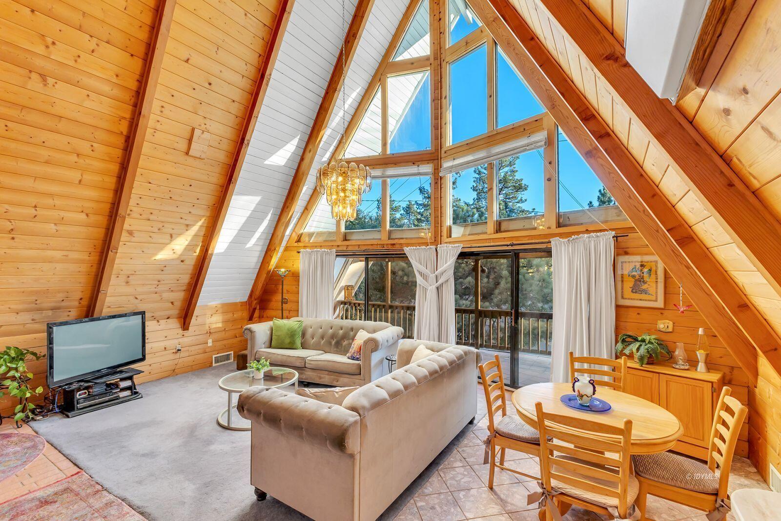 26750 Saunders Meadow Road, Unit 775 Idyllwild, CA 92549 - Photo 10 of 68 a living room with furniture and a floor to ceiling window