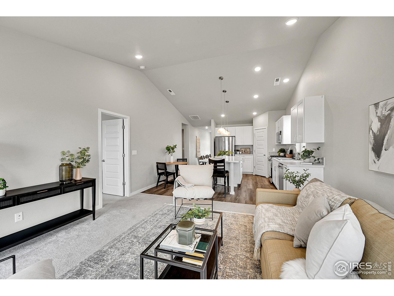 403 Pony Express Trail Ault, CO 80610 - Photo 10 of 31 a living room with furniture and a table