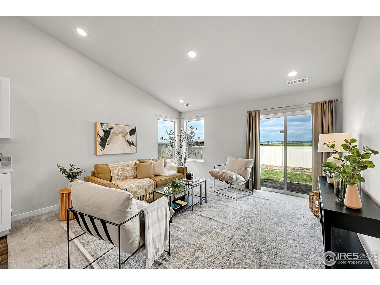 403 Pony Express Trail Ault, CO 80610 - Photo 11 of 31 a living room with furniture potted plant and a window