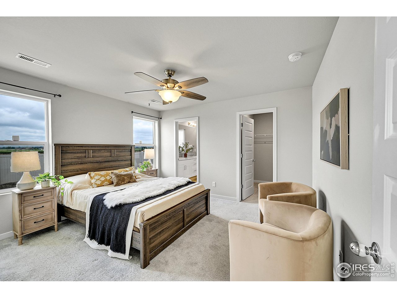 403 Pony Express Trail Ault, CO 80610 - Photo 13 of 31 a bedroom with a bed and window