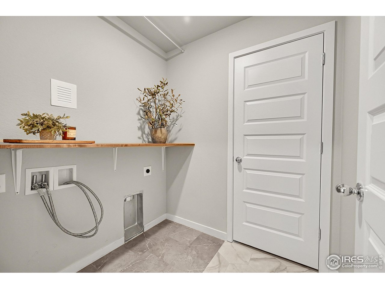 403 Pony Express Trail Ault, CO 80610 - Photo 25 of 31 a bathroom with a toilet a sink and a mirror