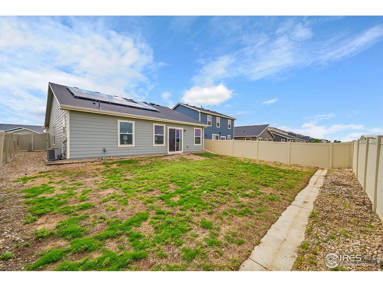 403 Pony Express Trail Ault, CO 80610 - Photo 26 of 31 a view of a house with a yard