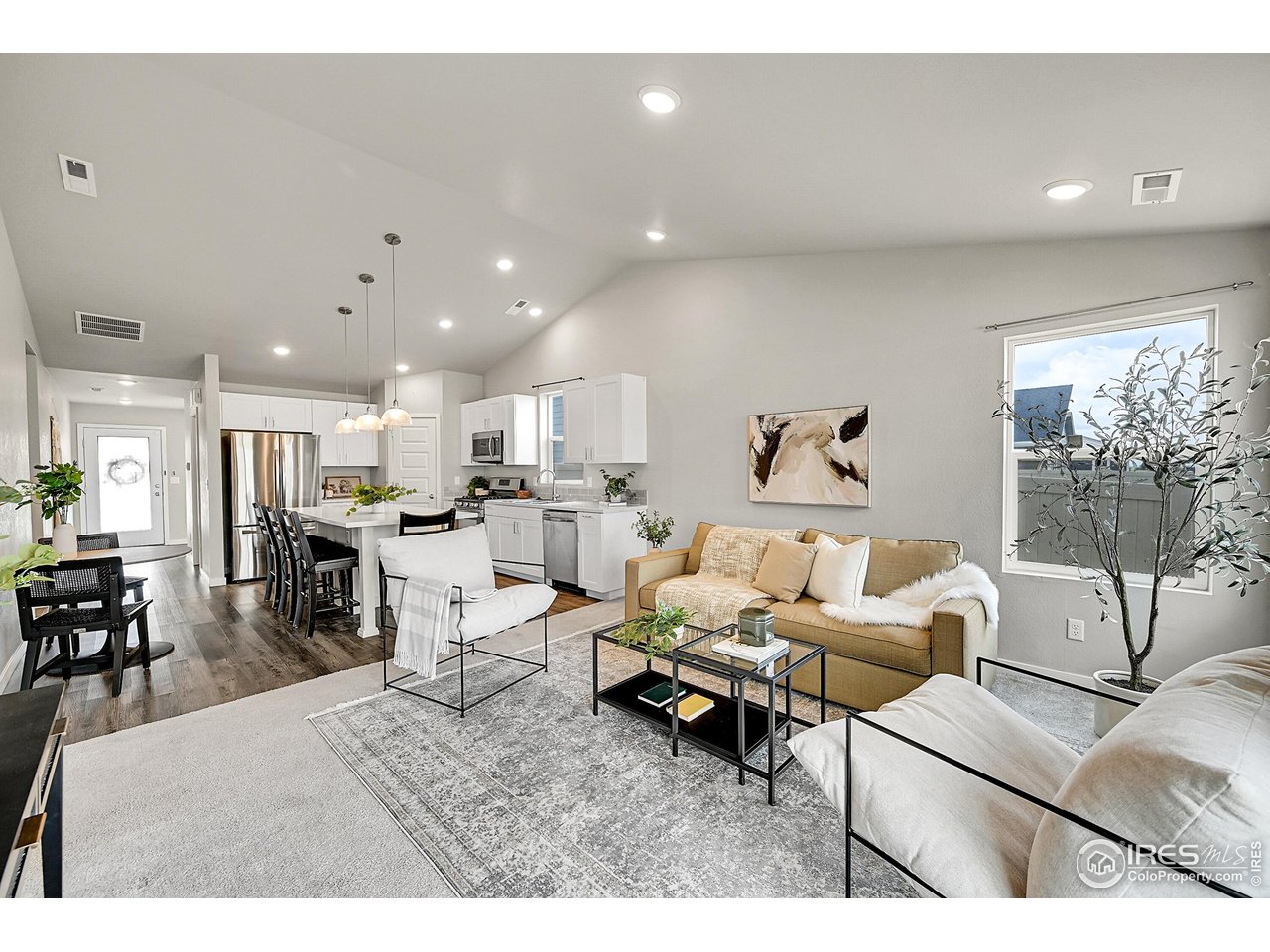 403 Pony Express Trail Ault, CO 80610 - Photo 30 of 31 a living room with furniture and kitchen view