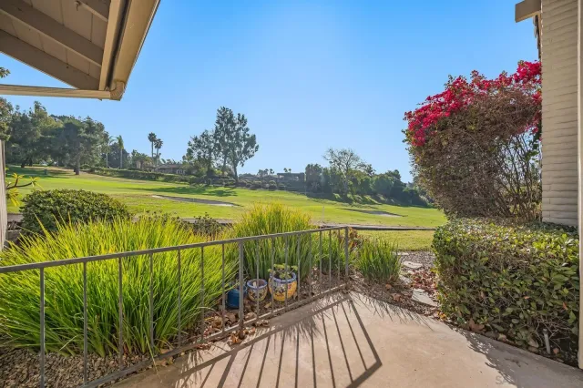 a view of a backyard with sitting area