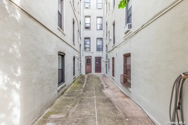 a view of a patio with table and chairs and potted plants