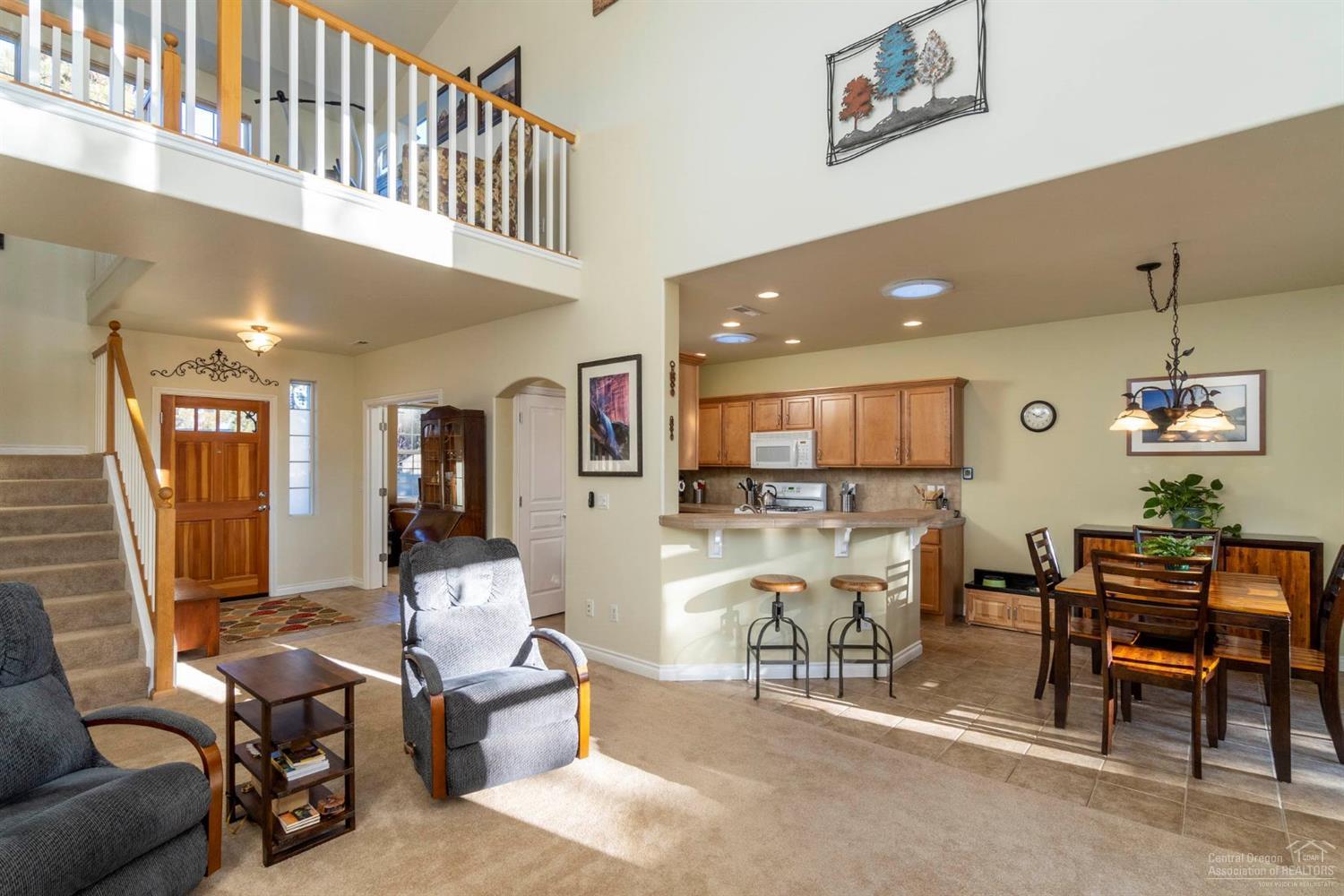 19569 Fishhawk Loop Bend, OR 97702 - Photo 4 of 25 Nice entry area with beautiful wood door