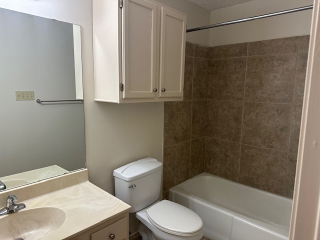 331 Fantail Loop, Unit B Austin, TX 78734 - Photo 13 of 16 Full bathroom with vanity, tub / shower combination, and a textured ceiling