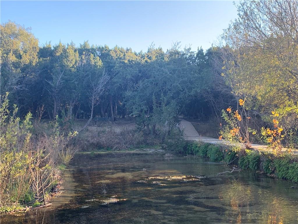 331 Fantail Loop, Unit B Austin, TX 78734 - Photo 2 of 17 a view of a lake with a mountain