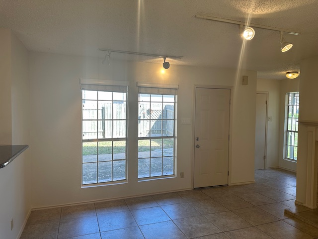 331 Fantail Loop, Unit B Austin, TX 78734 - Photo 5 of 17 a view of an empty room with a window