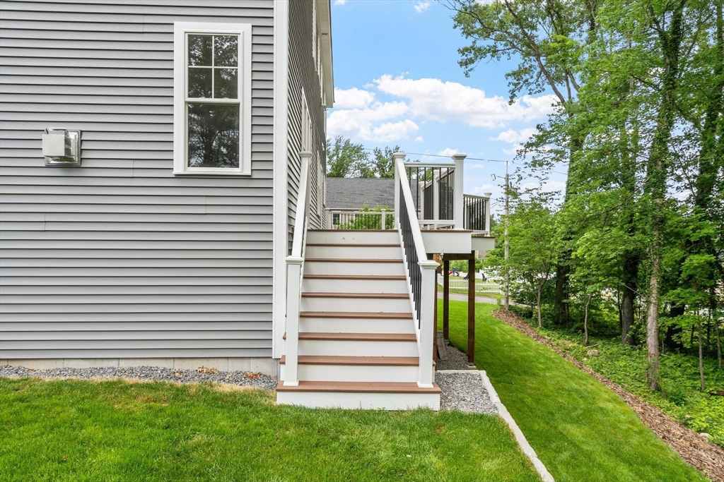 37 Dogwood Road Littleton, MA 01460 - Photo 22 of 36 a view of a house with a yard and a garden