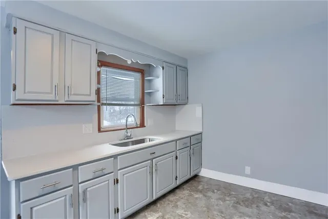 a kitchen with appliances cabinets and a sink
