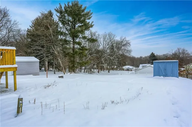 a pathway of a house with a yard