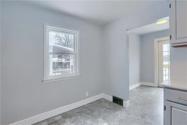 an empty room with windows