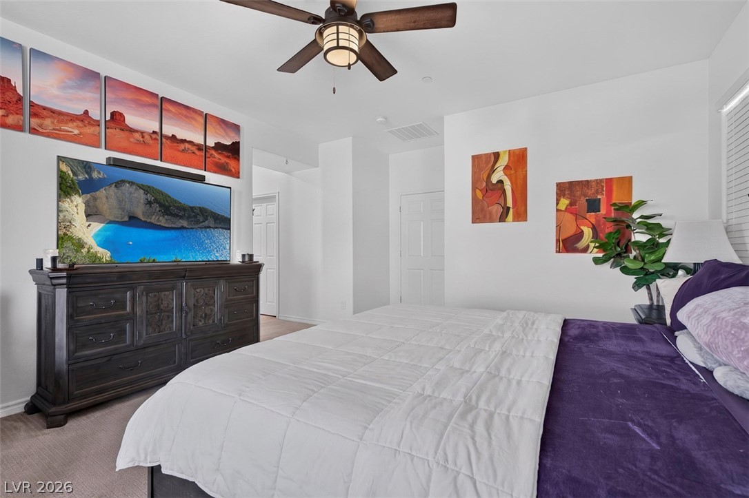 1824 Redland Ridge Street Henderson, NV 89002 - Photo 38 of 69 Overhead ceiling fan provides comfort in this inviting and private bedroom space.