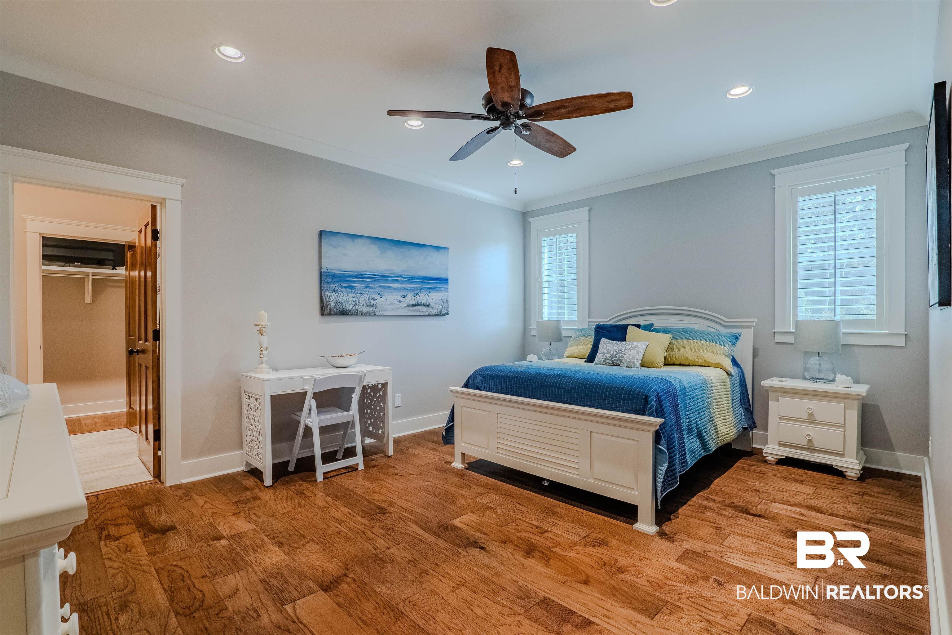 708 Manning Place Fairhope, AL 36532 - Photo 32 of 58 Bedroom featuring crown molding, ceiling fan, and light hardwood / wood-style flooring