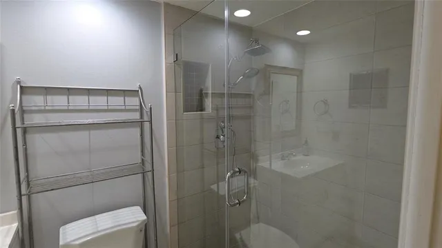 a bathroom with a shower and toilet