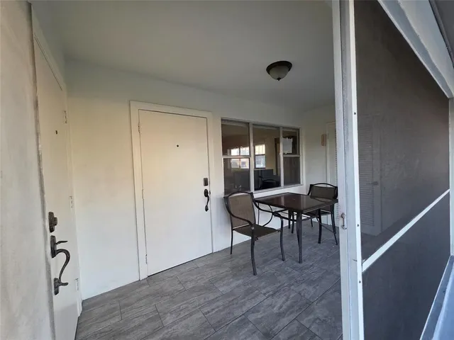 a view of a livingroom with furniture and window