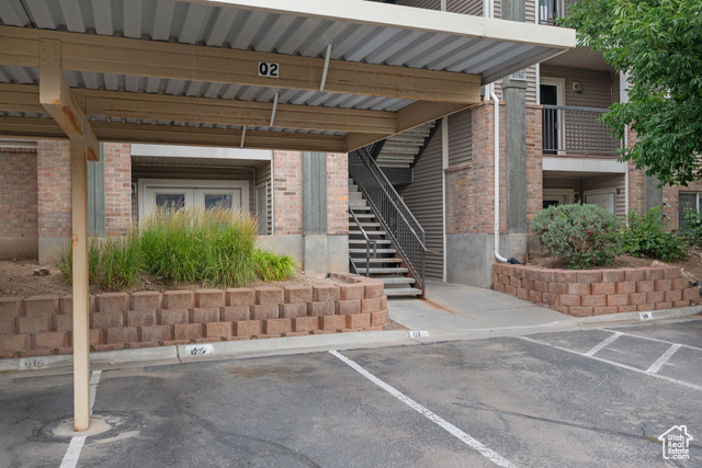8196 North Cedar Springs Road, Unit 2 Eagle Mountain, UT 84005 - Photo 5 of 22 Covered parking lot featuring stairway