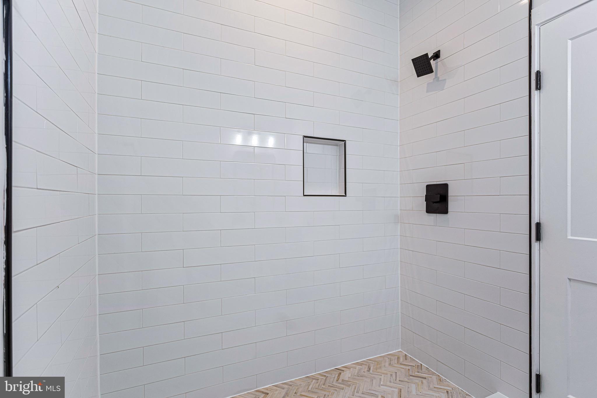 1107 Queen Street Northeast, Unit 2 Washington, DC 20002 - Photo 13 of 26 a bathroom with a shower