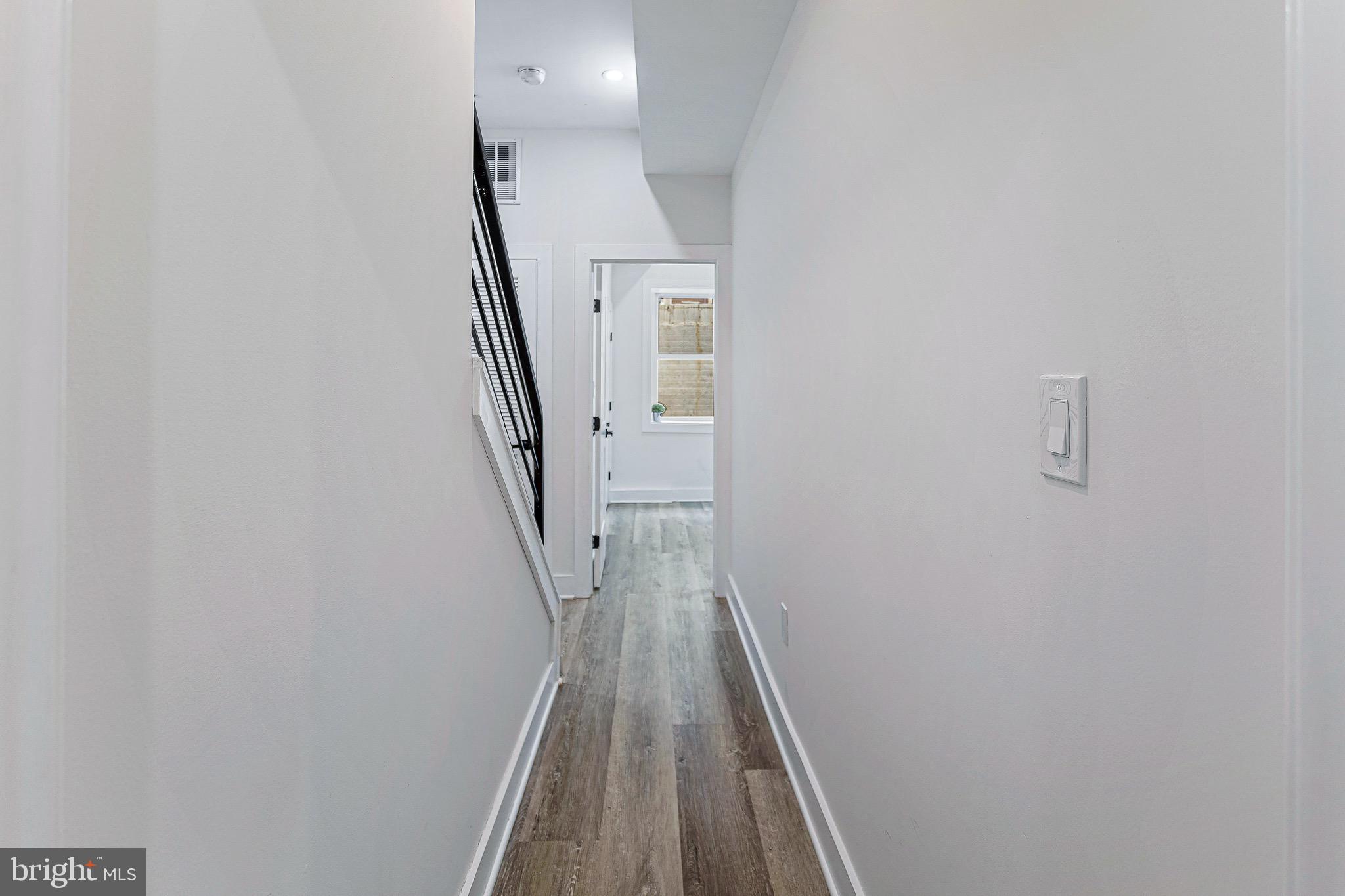 1107 Queen Street Northeast, Unit 2 Washington, DC 20002 - Photo 15 of 26 a view of a hallway with wooden floor and entryway