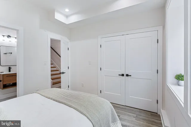 a bedroom with a bed and a closet
