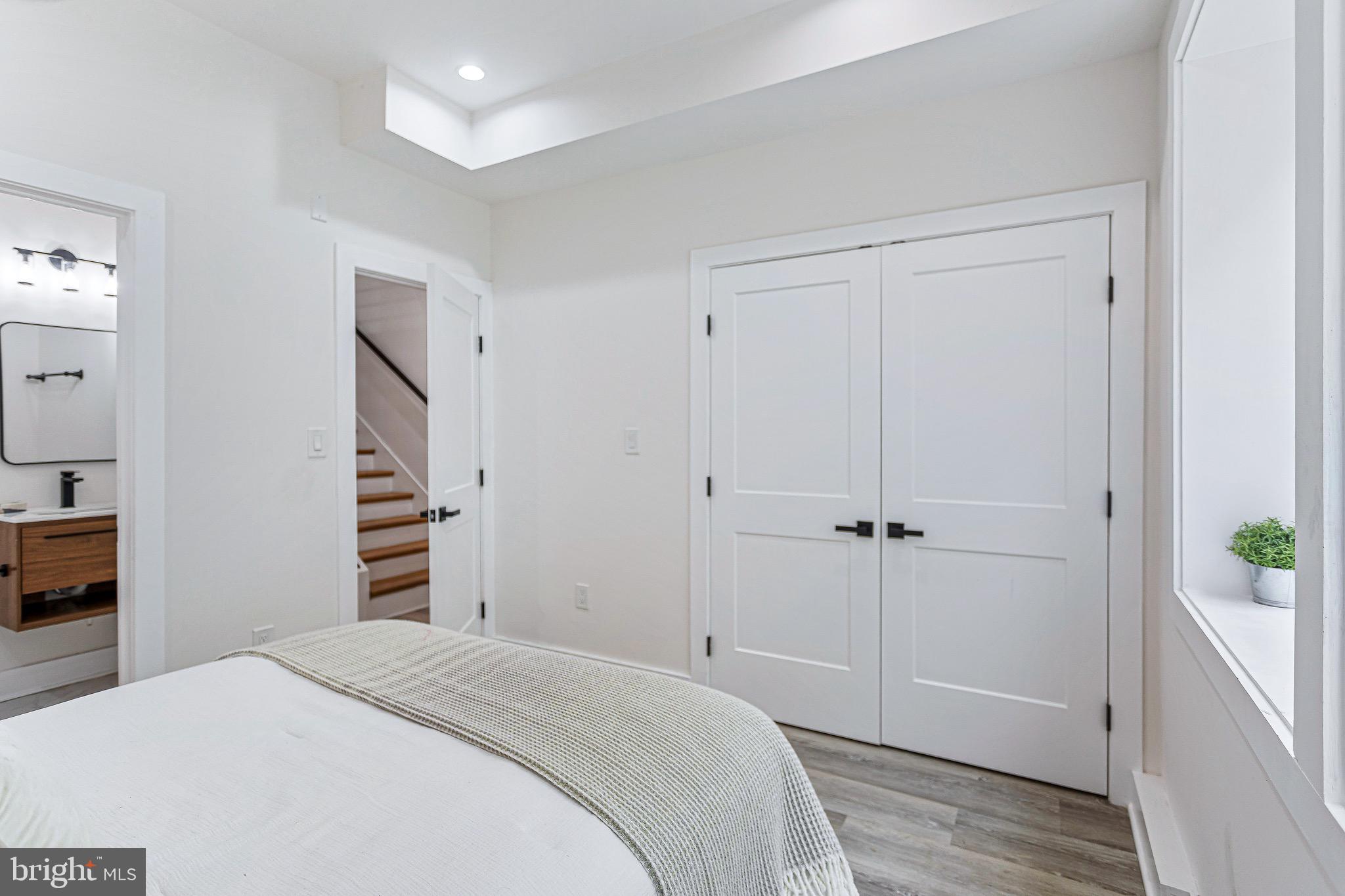 1107 Queen Street Northeast, Unit 2 Washington, DC 20002 - Photo 17 of 26 a bedroom with a bed and a closet
