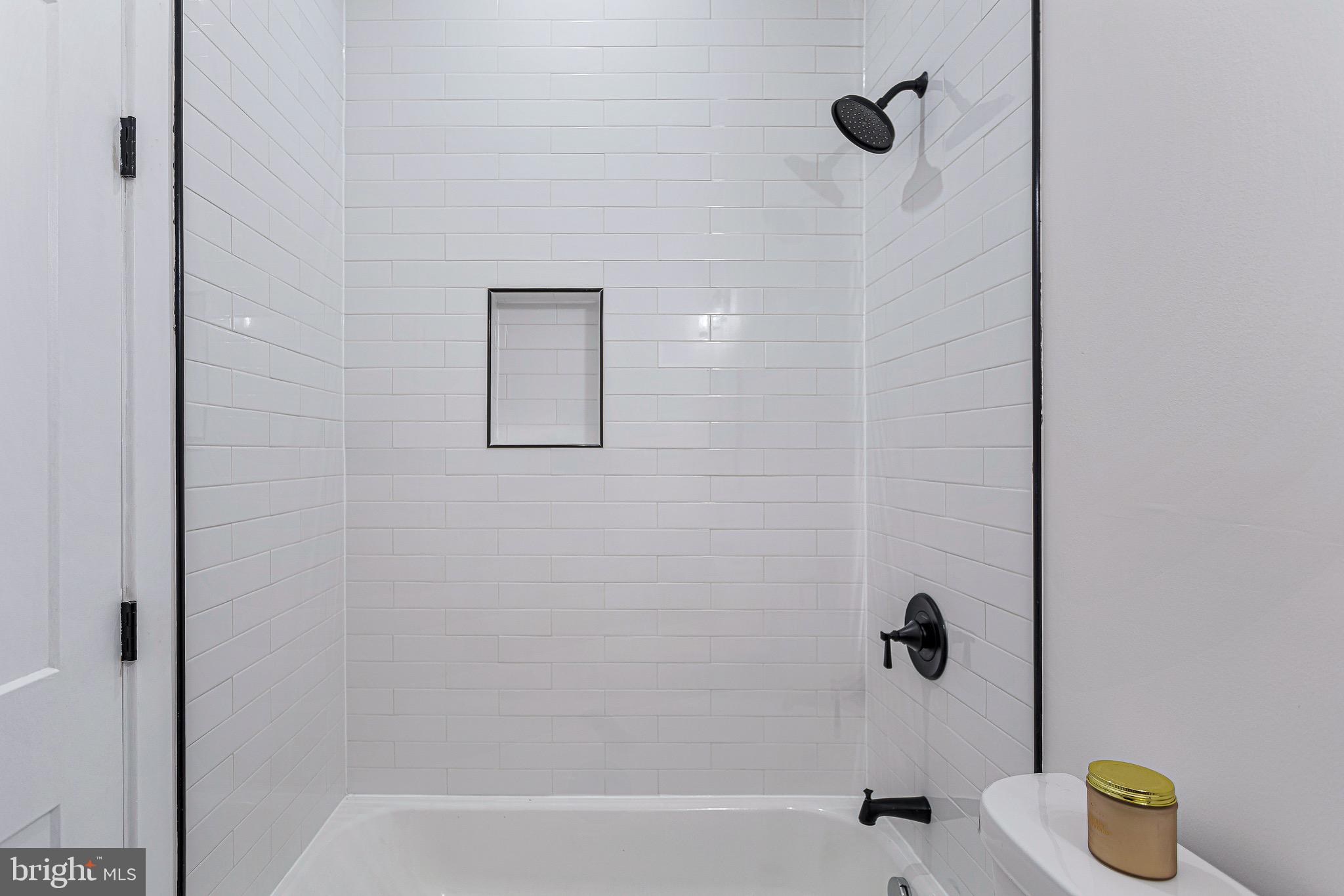 1107 Queen Street Northeast, Unit 2 Washington, DC 20002 - Photo 19 of 26 a bathroom with a bathtub