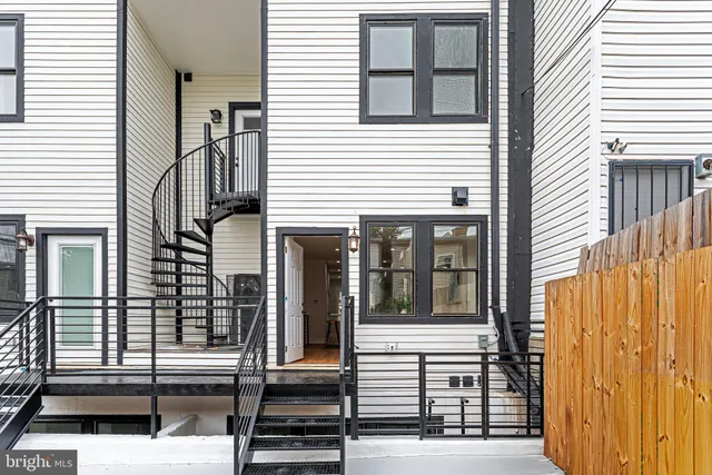 a front view of a house with glass windows