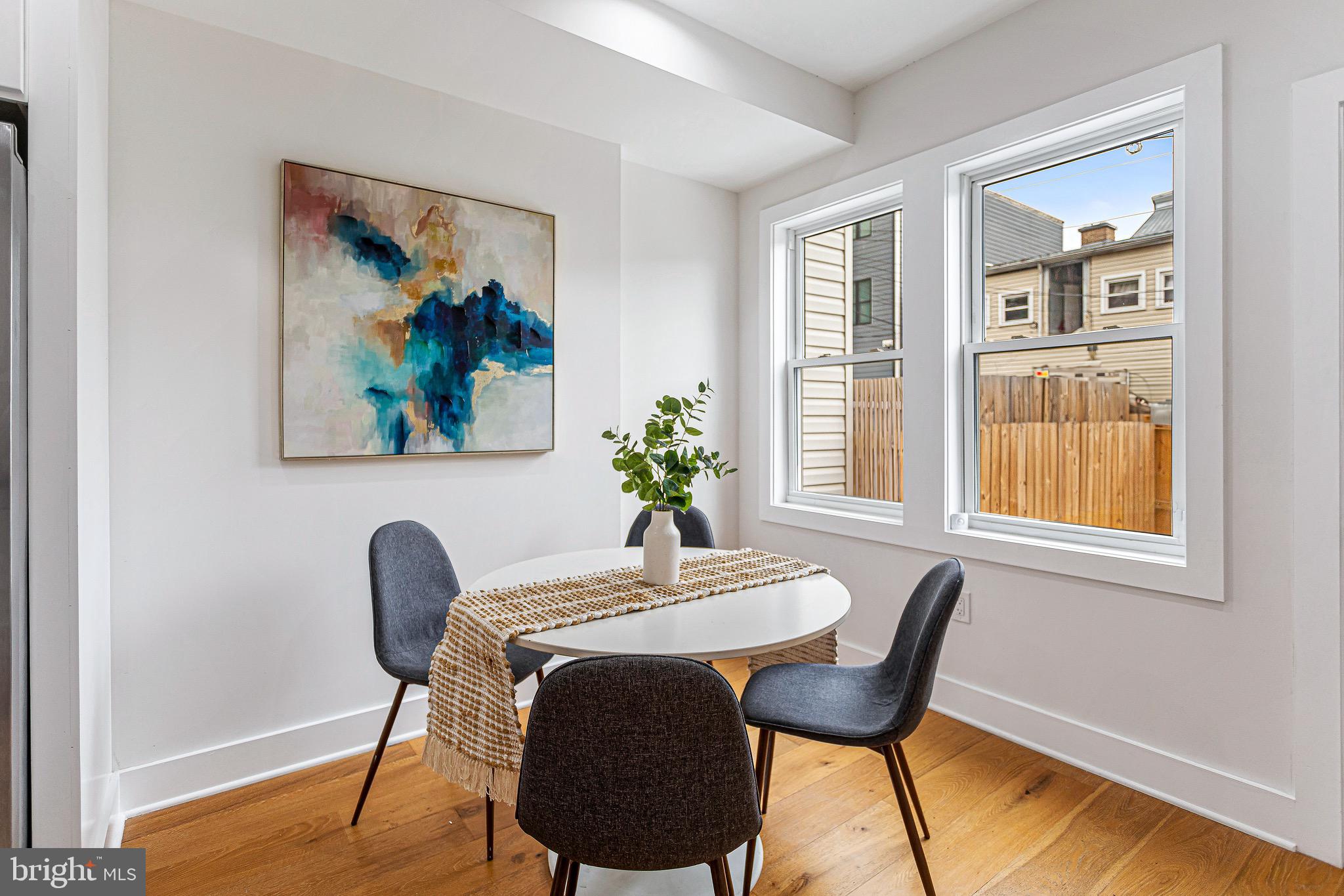 1107 Queen Street Northeast, Unit 2 Washington, DC 20002 - Photo 5 of 26 a view of a dining room with furniture and wooden floor