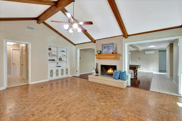 a view of livingroom with furniture fireplace and window